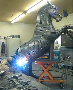 Welding a metal horse